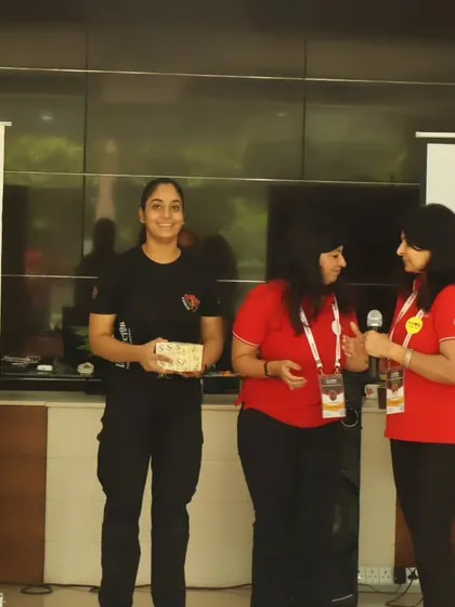 Our lead female instructor, Divya, being honored. Her presence is crucial for making female participants feel comfortable and inspired.