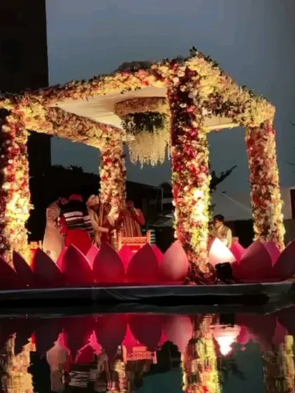 Imagine taking your vows on a mandap that floats on water. I specialize in bringing unique concepts like this floating lotus mandap to life, creating a truly magical and romantic setting for your wedding ceremony.