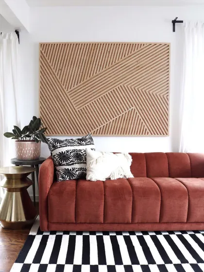 This large geometric wood art in an earth-tone finish adds a warm, organic feel to the room. It's a perfect statement piece for a modern, nature-inspired interior.