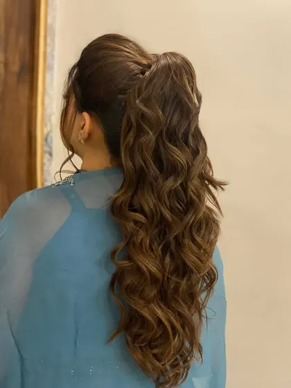 A messy tie look perfect for a bridesmaid. The soft, textured ponytail is romantic and stylish, and my extensions give it that beautiful, full appearance.