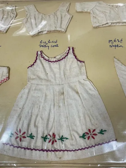 A miniature child's dress from my mother's 1963 journal, complete with delicate floral embroidery at the hem. I am so grateful for the skills and wisdom she passed on to me.