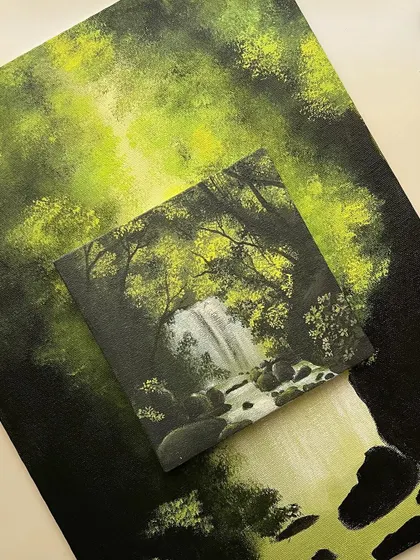 Another view of the small waterfall painting against its larger counterpart, showing the progress and the details.