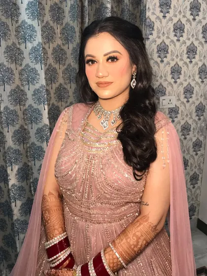 The full reception look, complete with the traditional red chooda.