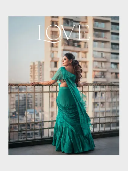 A modern bridal portrait with an urban backdrop. The bride's pose and the cityscape create a contemporary and stylish feel.