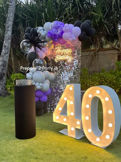 Celebrating 40 is a big deal. My designs for this milestone often include glamorous elements like sequin walls and neon signs, with customizable color palettes to suit any taste.