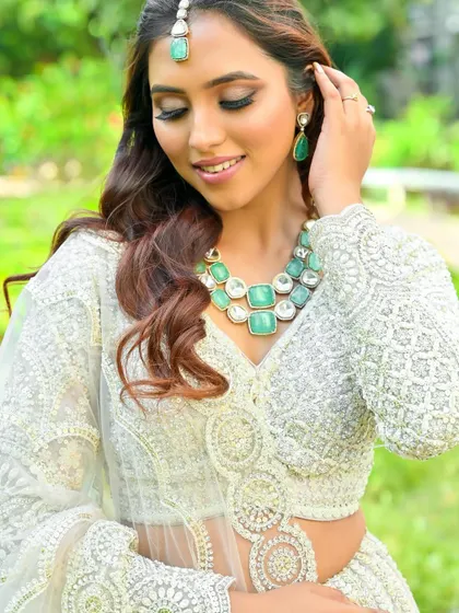 A close-up of our elegant white chikankari-style lehenga. The detailed threadwork is a testament to the quality and craftsmanship of our collection.