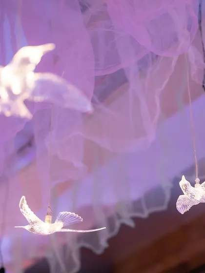 It's the little details that create magic. I hung these delicate, illuminated bird props from the ceiling to add to the enchanting atmosphere of the unicorn party.