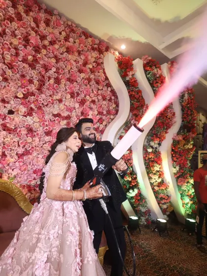 A fun and high-energy moment from an engagement party. The couple uses a CO2 smoke gun, adding a touch of modern fun and excitement to their celebration, and I was right there to capture their joyful expressions.