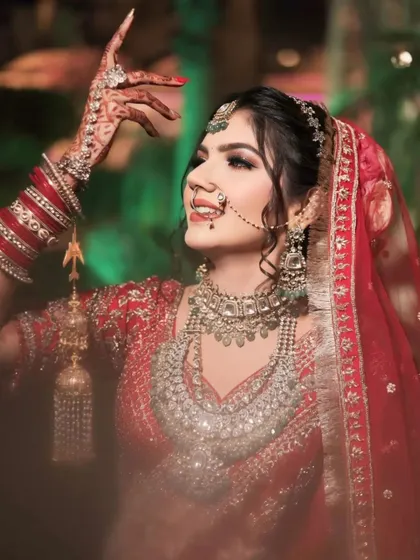 A moment of pure bliss, captured forever. The bride dances with joy, her hands raised, shining brightly on her big day.