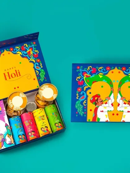 This 'Happy Holi' gift box is both beautiful and practical. It includes an assortment of gulal and two decorative diyas, perfect for corporate gifting.