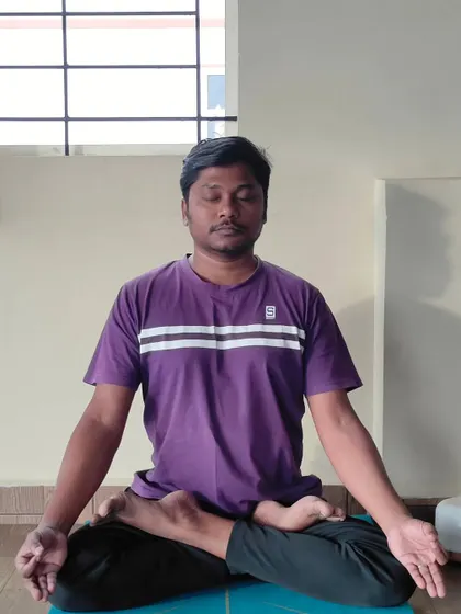 A student sits in Padmasana (Lotus Pose), ready for practice. My studio is a space for everyone to reset their mind and body, and I am here to guide you.