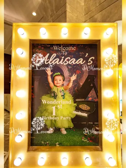 A personalized welcome sign for "Alaisaa's Wonderland," framed with marquee lights for a glamorous and inviting entrance.