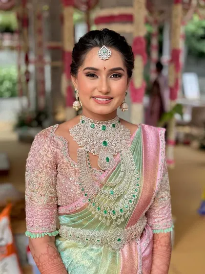 A vision in pastels. Manasa’s look is a testament to modern elegance, where soft, ethereal makeup complements her magnificent diamond jewelry and pastel Kanjivaram saree, creating a look that is fresh, radiant, and unforgettable.