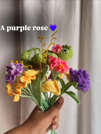 Adding a purple rose to the Rapunzel bouquet, diversifying the types of flowers in the arrangement.