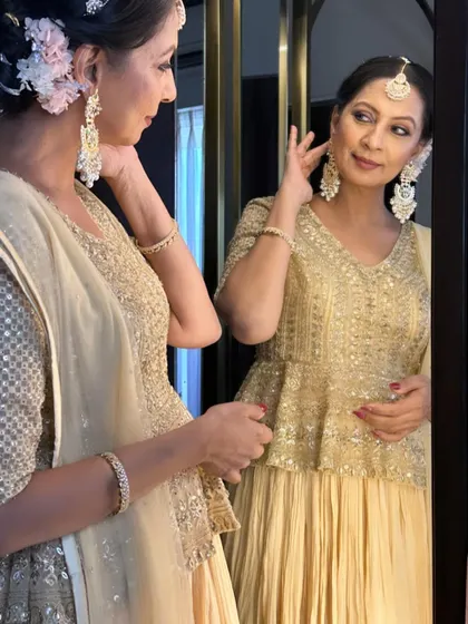 The mirror-check moment. It’s always rewarding to see a client admire the final look, feeling confident and beautiful.