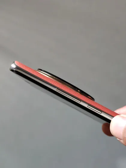 A side profile of the Realme 12 Pro+, focusing on its slim design and the texture of the volume rockers. It's these small details that convey a sense of quality.