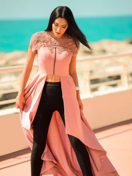A duplicate image from the Dubai beachside series, emphasizing the flow and design of the pink high-low top.