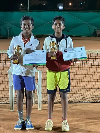 Krish celebrating his runner-up finish in the U12 doubles open tournament in Bangalore. Every tournament is a learning experience.