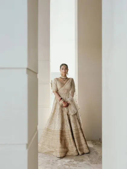 A beautifully framed portrait of Manchal. The use of pillars and negative space creates a modern, artistic composition that highlights her elegance.