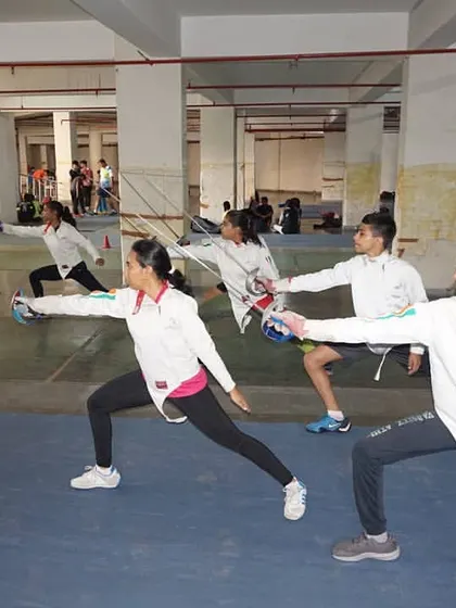 Our fencers practice their en garde stance and blade presentation in unison. Group drills like these instill discipline and ensure every athlete masters the fundamentals of fencing.