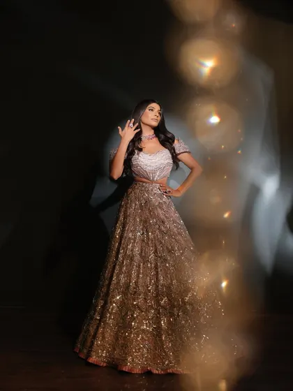 An artistic shot of Farhana Bodi, with beautiful bokeh effects that add to the magical, glamorous feel of the photoshoot.