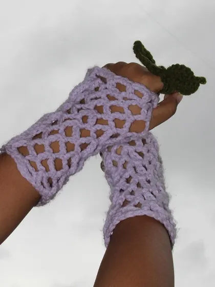 Feel the lavender love with these cozy, fingerless crochet gloves. The mesh stitch makes them stylish and comfortable, perfect for when you want a little warmth without sacrificing dexterity.
