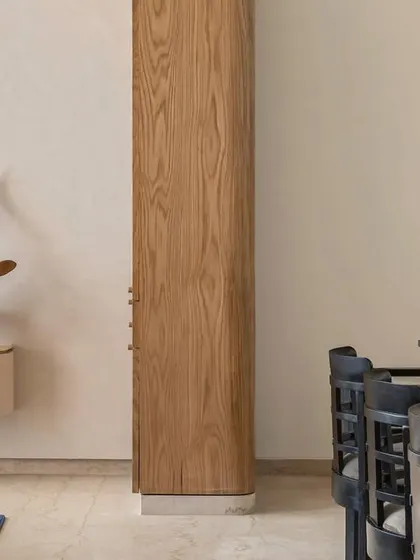 A detail shot from Apartment 3201, showing the clean lines of the custom cabinetry and a glimpse into the living area.