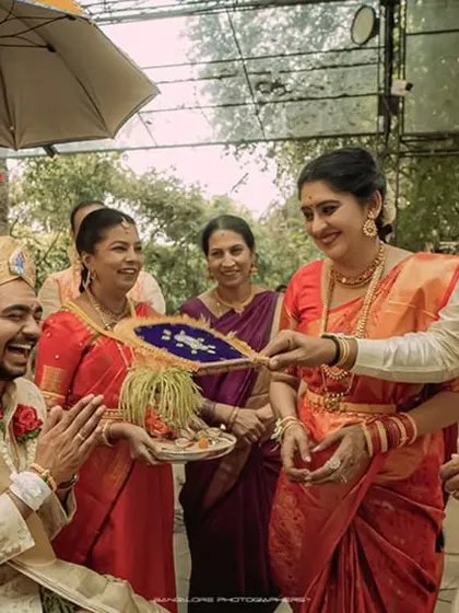 A candid moment of laughter and fun during a wedding ritual. These are the memories that families will cherish for a lifetime.