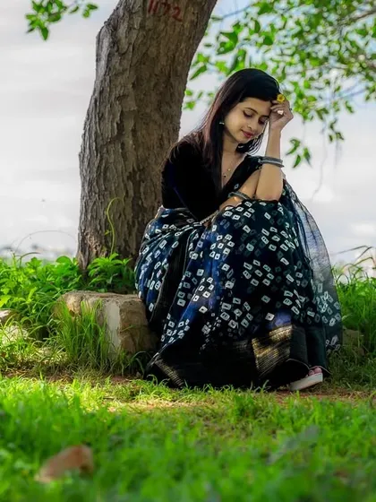 A moment of quiet contemplation under a tree. These are the kinds of unposed, natural shots I love to capture, showing a different, more introspective side.