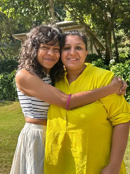A warm hug between friends at our 'Realign' retreat. These small moments of connection and support are the glimmers that spark joy and a sense of safety within our community.