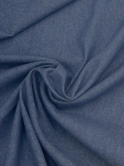 Our classic denim fabric, perfect for creating timeless and durable outfits. Its versatile nature makes it a wardrobe staple.
