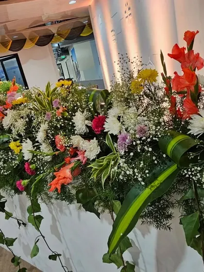 Another angle of the long floral runner I created for the UPS office inauguration. The arrangement is designed to look full and beautiful from all sides, enhancing the entire room.