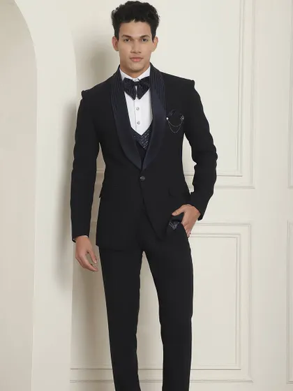 Some occasions demand a special designer tuxedo. This classic black tuxedo with a patterned waistcoat is perfect for your reception or cocktail party.