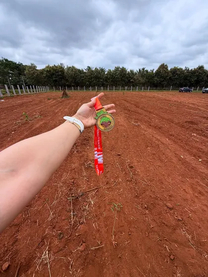 A shot of the medal against the backdrop of the race course. A reminder of the journey and the beautiful places running can take you.