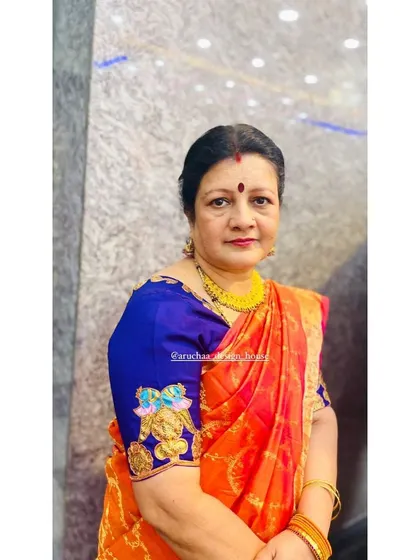 Here is a wonderful client wearing a custom blouse featuring my hand-painted Tanjore art. I added this intricate peacock motif to the sleeve of her silk blouse, turning a simple garment into a unique piece of wearable art that complements her beautiful orange saree.