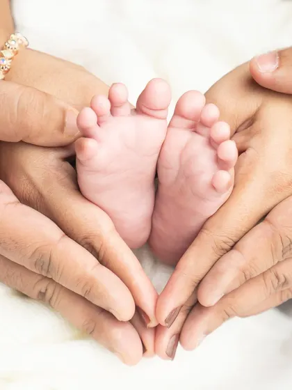 Sometimes, the smallest details tell the biggest story. I love capturing these tiny feet, held so lovingly in their parents' hands, a reminder of how small they once were.