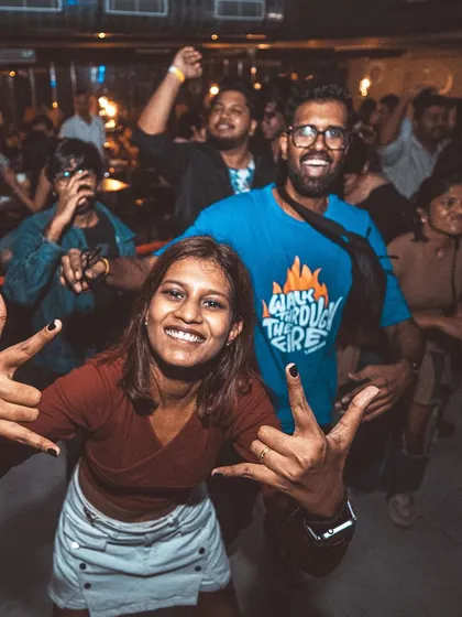 Another shot of the energetic couple. Their happiness is a testament to the vibe of the night.