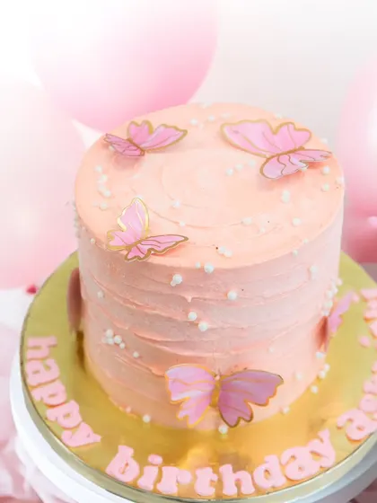 Butterfly kisses and sweet birthday wishes! A simple yet beautiful pink cake adorned with delicate wafer paper butterflies.