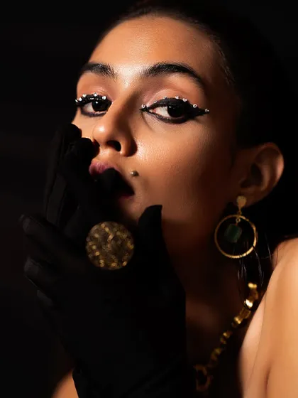 A "Jet Black Vibes" concept shoot I directed and styled. I used a black-on-black theme with a leather corset, turban, and dramatic, crystal-studded eye makeup to create a powerful and mysterious editorial look.