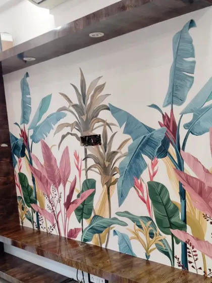A colorful botanical wallpaper installed in a TV niche in Marine Lines. I precisely cut the wallpaper to fit the unit, ensuring a clean and integrated look.