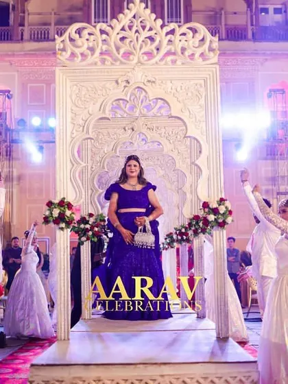 A beautiful shot of the bride's anniversary entry, with dancers in a celebratory pose. The entire setup is designed to create a picture-perfect moment of joy and grandeur.