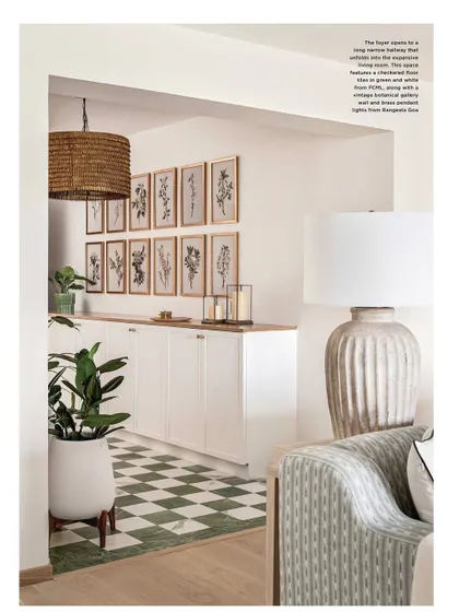 This shot from our magazine feature highlights the foyer, with its checkered floor and botanical gallery wall. The space introduces the home's breezy, coastal theme beautifully.