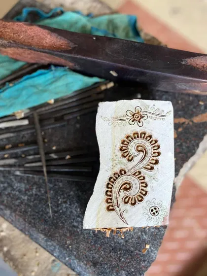 A close-up of a freshly carved block, ready for its first print. The crisp lines and intricate details showcase the precision and artistry that go into every single one of our custom and heritage designs.