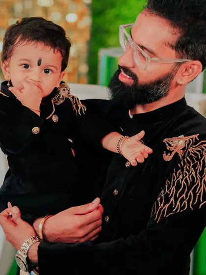 Like father, like son, pure royalty. 👑 I designed this matching father-son set featuring black velvet bandhgalas with custom gold tiger embroidery on the shoulder. It's a power move for any big event.