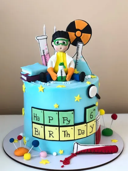 Another view of the science-themed cake, showing all the fun, edible experiments and details.