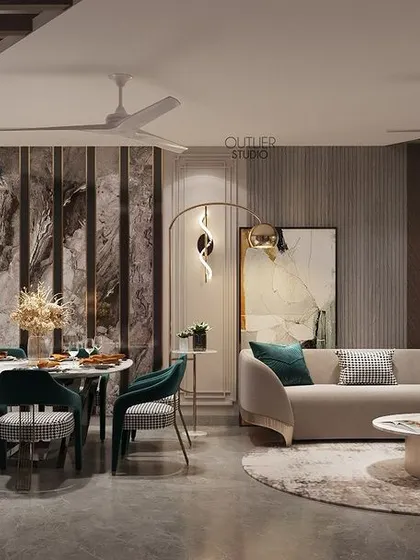 Meals and memories are made here. This dining room is magnificent in every sense, with elegant teal chairs, a modern art piece, and sculptural wall sconces that create a beautiful and inviting atmosphere.