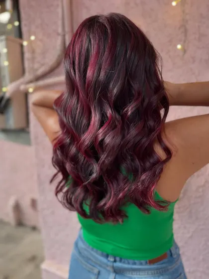 A side view of the red balayage. The soft waves really make the color pop. (No filter)