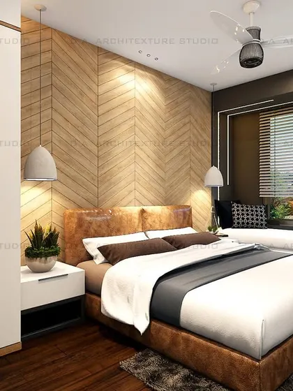 A sophisticated bedroom design with a chevron-patterned wooden accent wall and a cozy window-side seating nook.