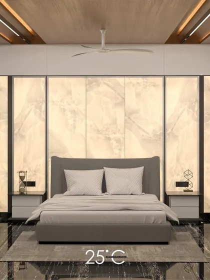 This bedroom design achieves a serene and luxurious feel with a backlit alabaster-style panel behind the bed. The soft, diffused light creates a calming glow, complemented by the sleek black marble flooring and minimalist furniture.