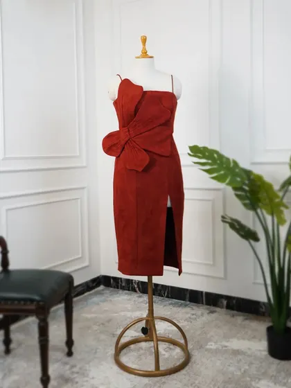 This red dress is for someone who loves a classic silhouette with a hint of drama. The oversized 3D flower adds a unique, sculptural element to the design.